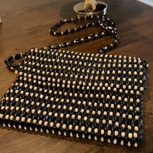 Nicely wood beaded shoulder bag .